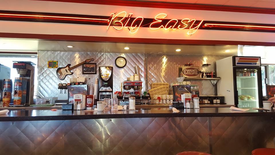 Big Easy Diner counter with neon sign and brushed steel wall